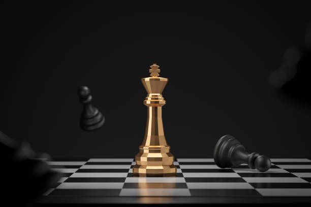 Golden chess piece on dark background with winner or victory concept. King of chess and competition ideas. 3D rendering. Golden chess piece on dark background with winner or victory concept. King of chess and competition ideas. 3D rendering. king chess piece stock pictures, royalty-free photos & images