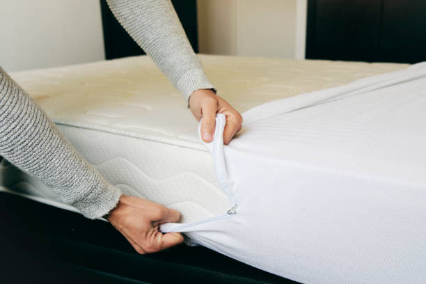 istock man covering a mattress with a mattress protector 1223365174