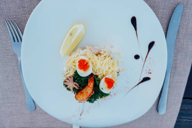 istock salad plate with cheese, caviar, lemon, food 1223365763