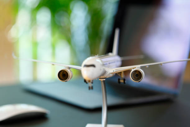 istock Airplane model in front of a Laptop 1223370439