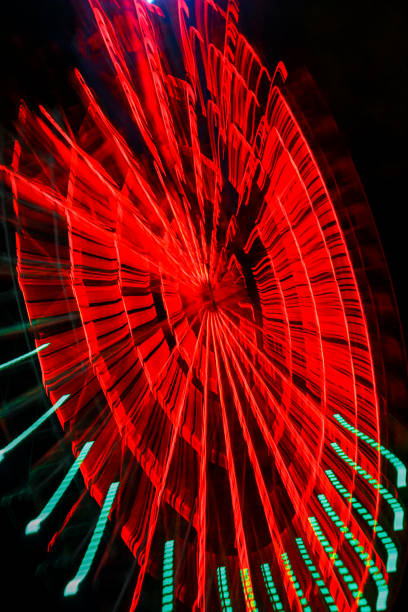 istock luminous ferris wheel at night colored lights movement 1223370963