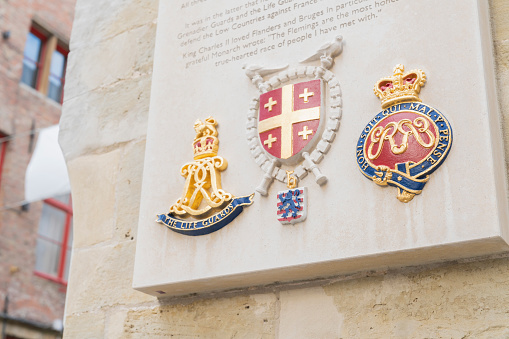 Brugge/Belgium-Oct 28 2019: detail of stone signage of royal house famous landmark travel destination in Brugge