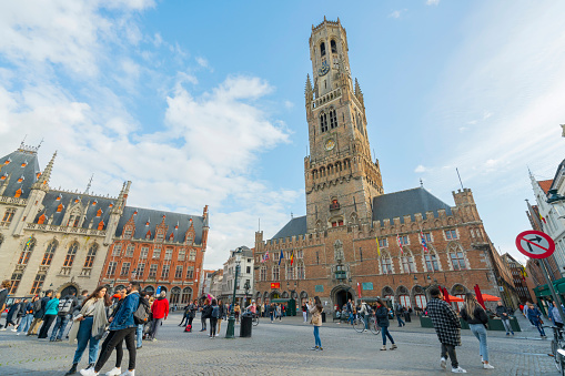 Bruges/Belgium-Oct 28 2019:Bellfry and City Hall at Market Square in Bruges, the capital of West Flanders in northwest Belgium, Traditional Colorful Brick Buildings in Market Square