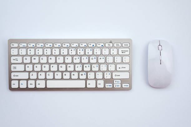 istock Top view office white desk with a mouse and keyboard 1223371877