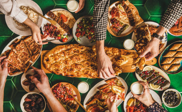 istock Muslim traditional Ramadan iftar family dinner table with various foods 1223372790
