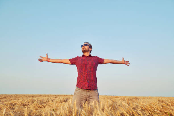 Man enjoying in wheat field. Nature concept.