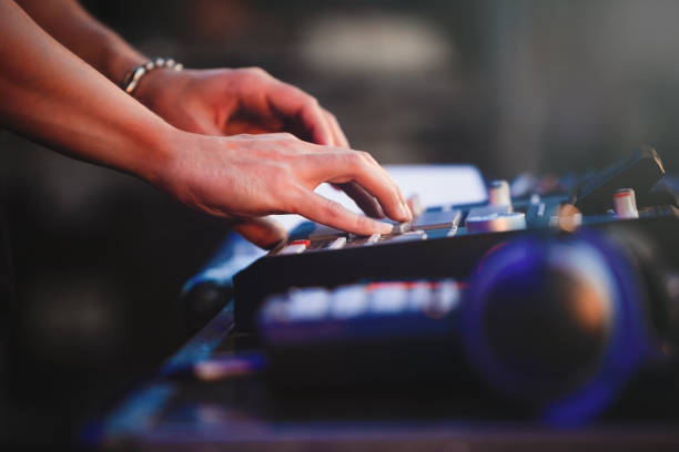 Dj plays beats on drum machine.Hip hop disc jockey playing on concert stage with professional midi controller device. Pro audio equipment on night club party.Analog pad controller,musical instrument drum percussion instrument photos stock pictures, royalty-free photos & images