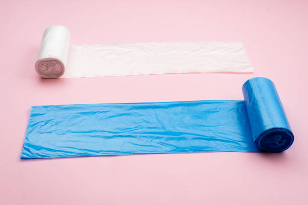 istock blue and white garbage bag isolated on a pink background 1223373982