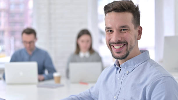istock Young Man Smiling at the Camera 1223375062