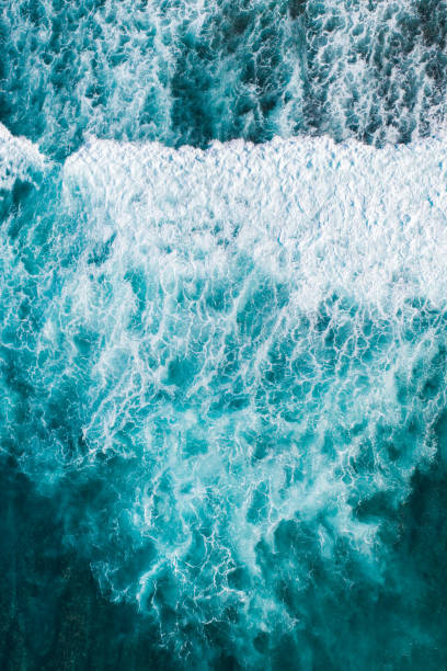 istock Big ocean waves hitting a coral rif. View from above. 1223375336