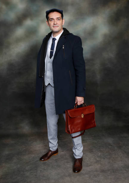 istock Handsome middle aged man posing in studio on isolated background. 1223375650