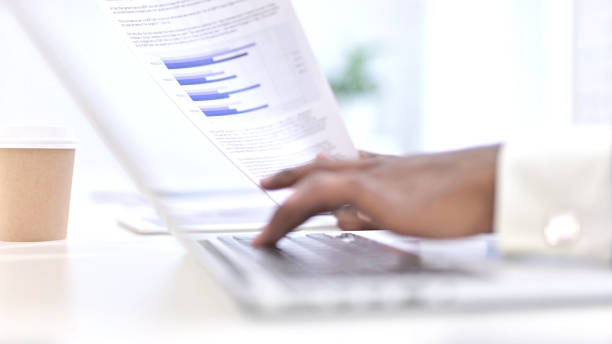 istock Hands of African Man Typing on Laptop 1223375663