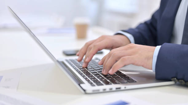 istock Businessman Typing on Laptop 1223375825