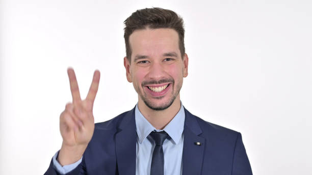 istock Successful Young Businessman showing Victory Sign , White Background 1223376608