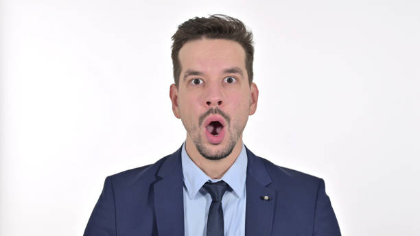 istock Upset Young Businessman feeling Shocked, White Background 1223376749