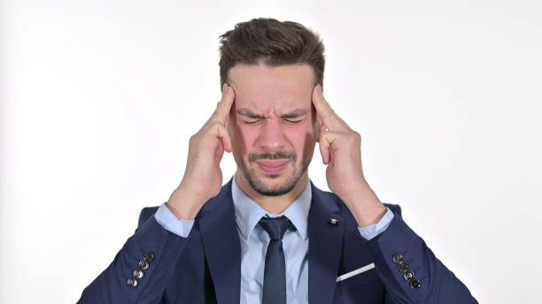 istock Tired Young Businessman having Headache, White Background 1223376758