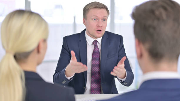 istock Angry Businessman Scolding Team in Office 1223377194