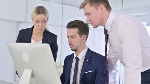 istock Ambitious Business Team Discussing and Working on Desktop 1223377312