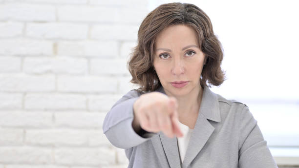 istock Old Woman Pointing Finger at Camera 1223377531