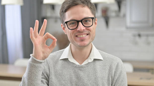 istock Ok Sign by Satisfied Young Man 1223377598
