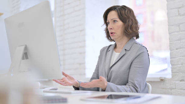 istock Creative Old Woman Upset by Loss at Work 1223377726