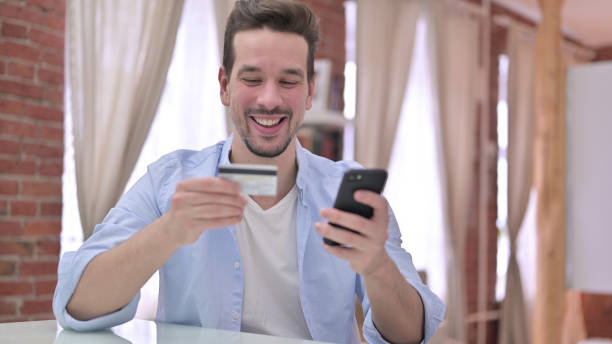 istock Successful Online Shopping on Smartphone by Happy Man 1223377848