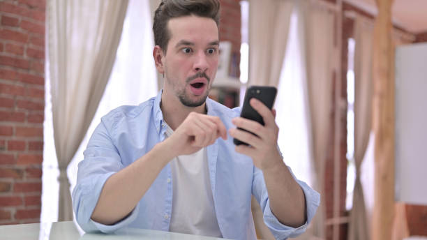 istock Young Man get Disappointed on Smartphone 1223377975