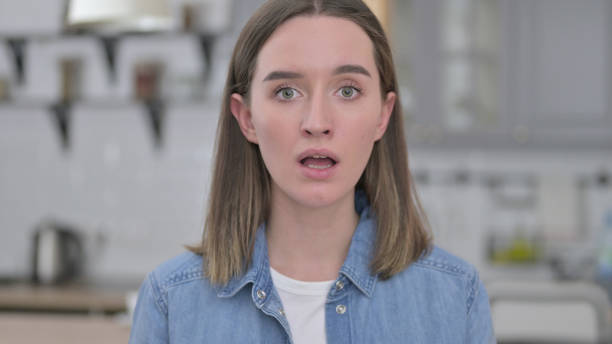 istock Disappointed Young Woman Shocked by Loss 1223378890