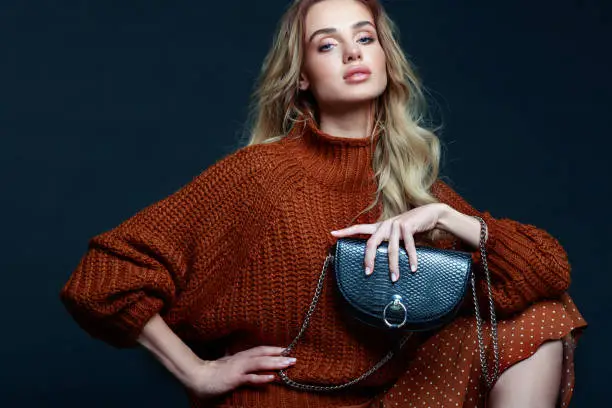 Photo of Fashion portrait of elegant woman in brown sweater