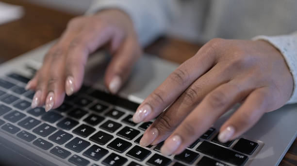 istock African Woman Hands Typing on Laptop 1223379058