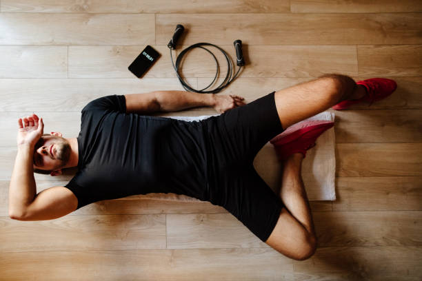 istock overtrained syndrome athlete lays on floor 1223379138