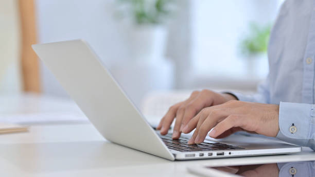 istock Close Up of Hands Typing on Laptop 1223379165