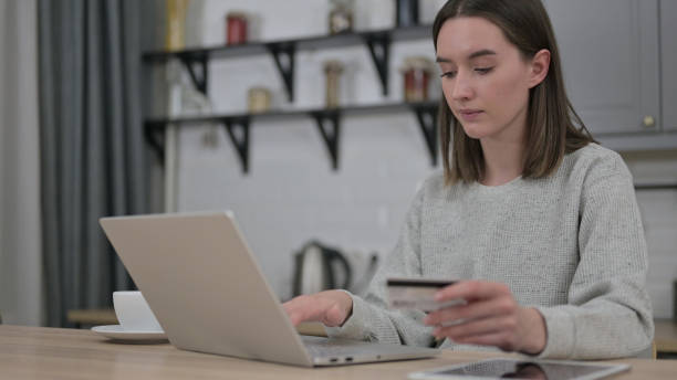 istock Online Payment by Young Woman on Laptop 1223379212
