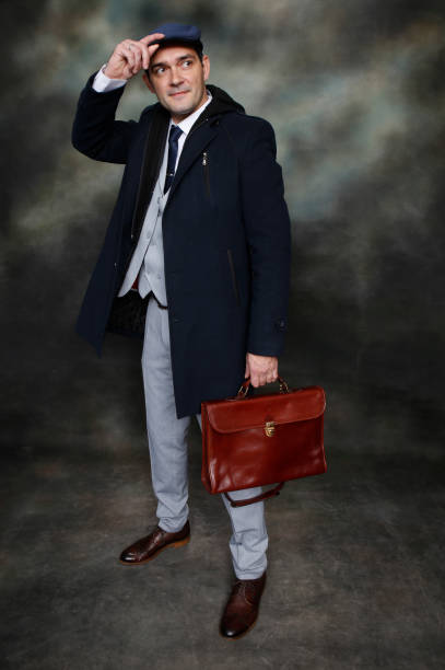 istock Handsome middle aged man posing in studio on isolated background. 1223379693