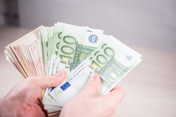istock Man holding paper money - euros in the hand-3 1223380607