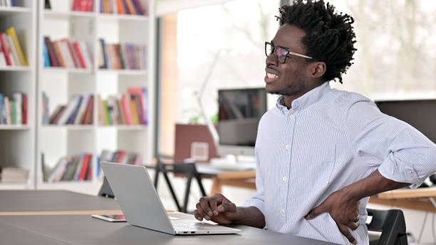 istock African Man having Back Pain at Work 1223380831