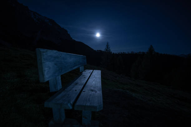 A view of a mountain peak near Kabul, Afghanistan. Full moon in the background