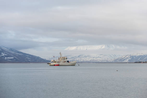 istock White fishing vessel at anchor 1223385225