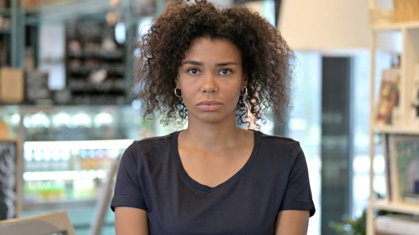 istock Attractive Young African Woman Looking at Camera 1223385539