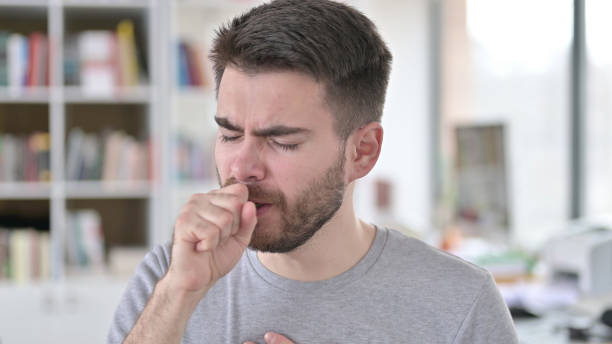 istock Portrait of Sick Young Man Coughing, Allergic 1223385698