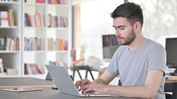 istock Laptop use by Professional Young Man in Office 1223385999