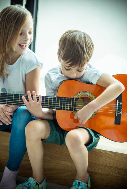 istock Kids playing a guitar 1223387277