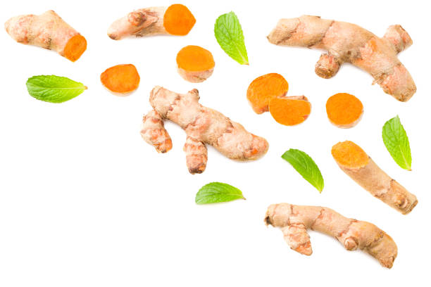istock Turmeric root with turmeric slices isolated on white background. Top view. 1223387785