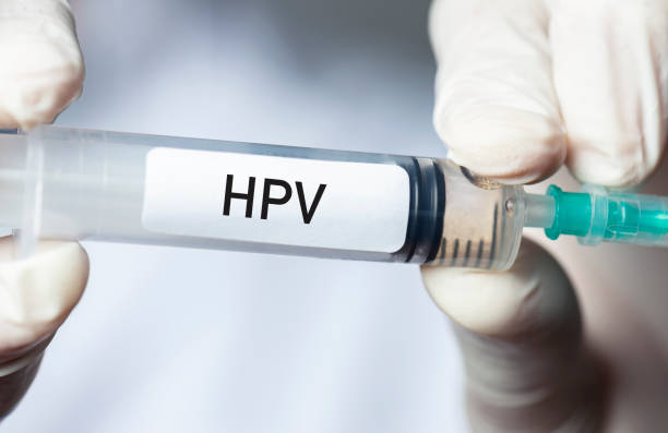 HPV Vaccine Doctor holding Human Papilloma Virus vaccine. human papilloma virus photos stock pictures, royalty-free photos & images