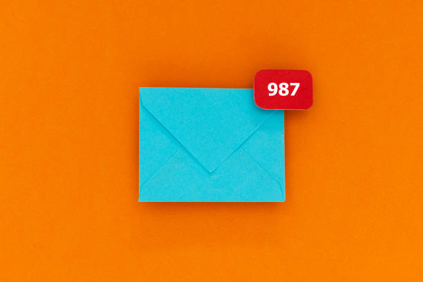 Burnout Blue envelope with notification sign with the number 987. Representing accumulated mails in mailbox. e mail inbox photos stock pictures, royalty-free photos & images