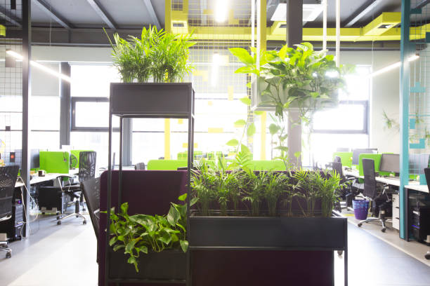 istock Office interior with loft windows, yellow pipes and green workplaces 1223388897
