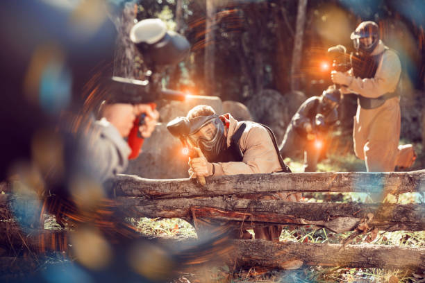 istock People in full gear playing paintball 1223389228