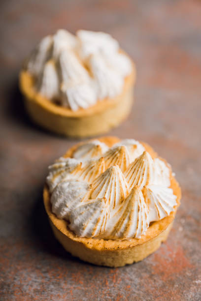 istock Creamy cake decorated with meringue cream on the rustic background 1223390213