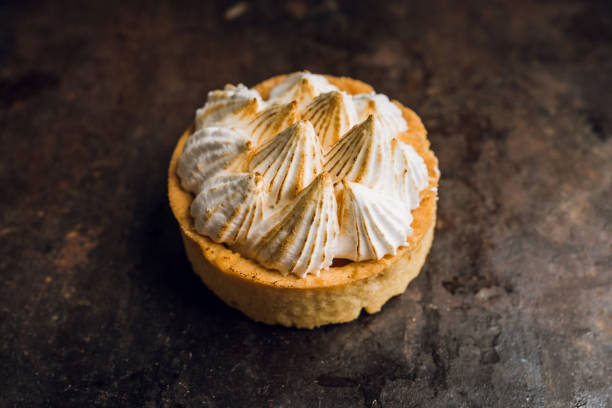 istock Creamy cake decorated with meringue cream on the rustic background 1223390225