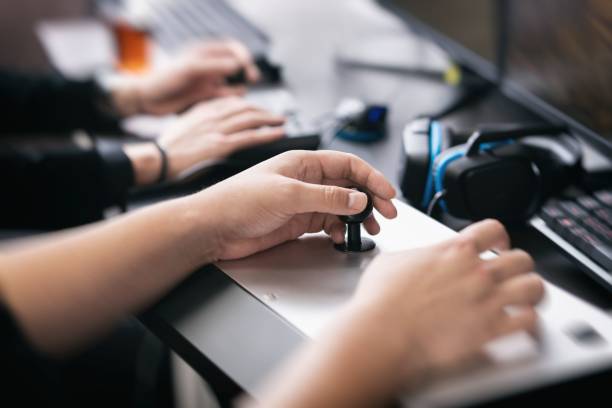 istock A man operating a fighting stick in a fighting game 1223390857